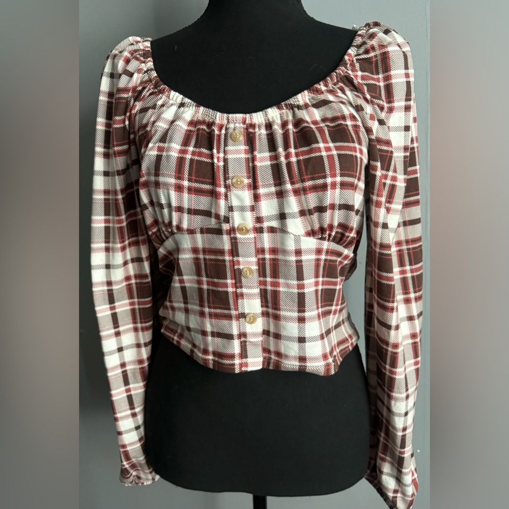 Santory Size Large. Off the shoulder shirt that shows stomach.